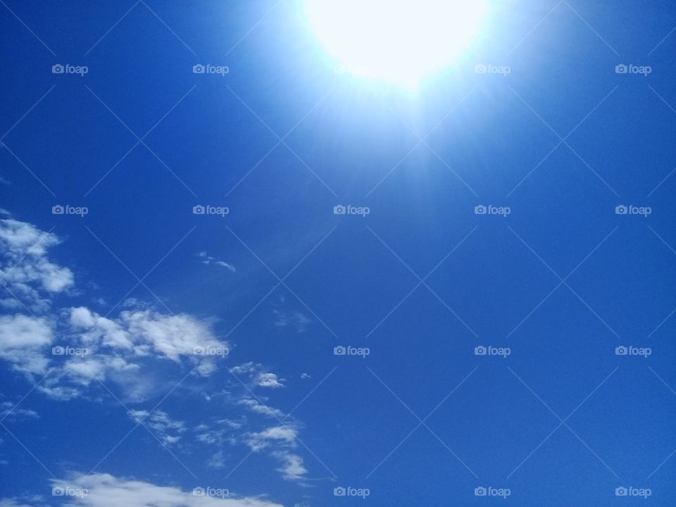 Blue sky with combination white cloud and sun
