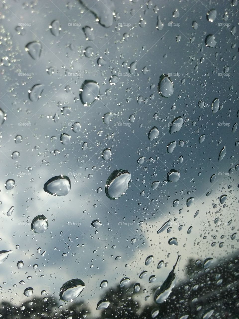 rain drops. sitting in my car watching the rain