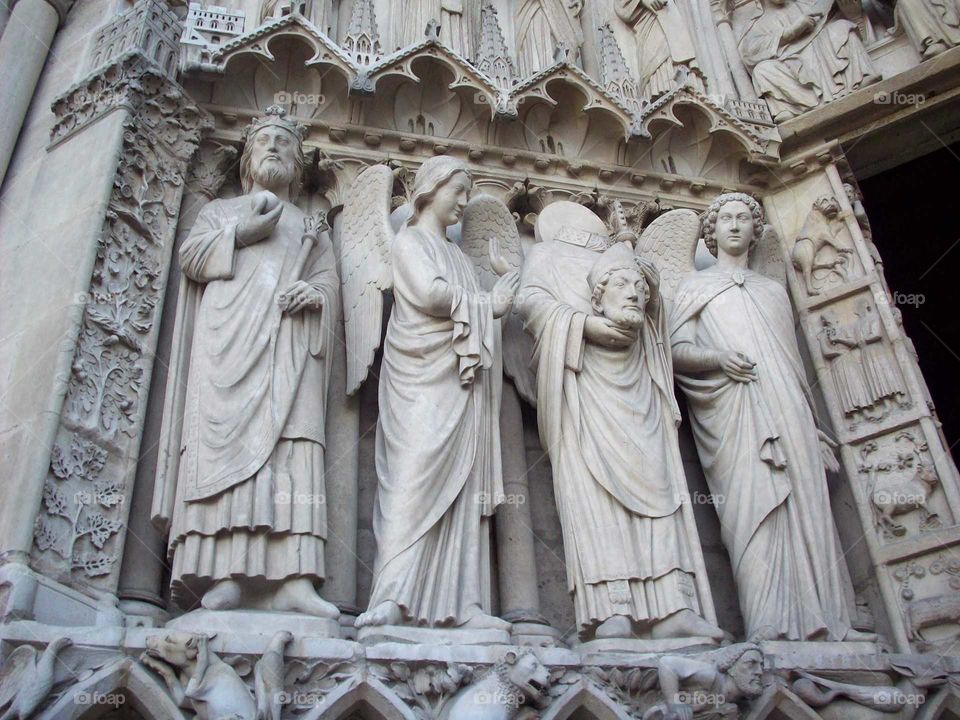 sculpted saints and angels of Notre Dame