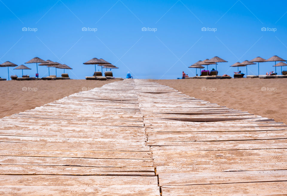 Wooden footpath to beach paradise.