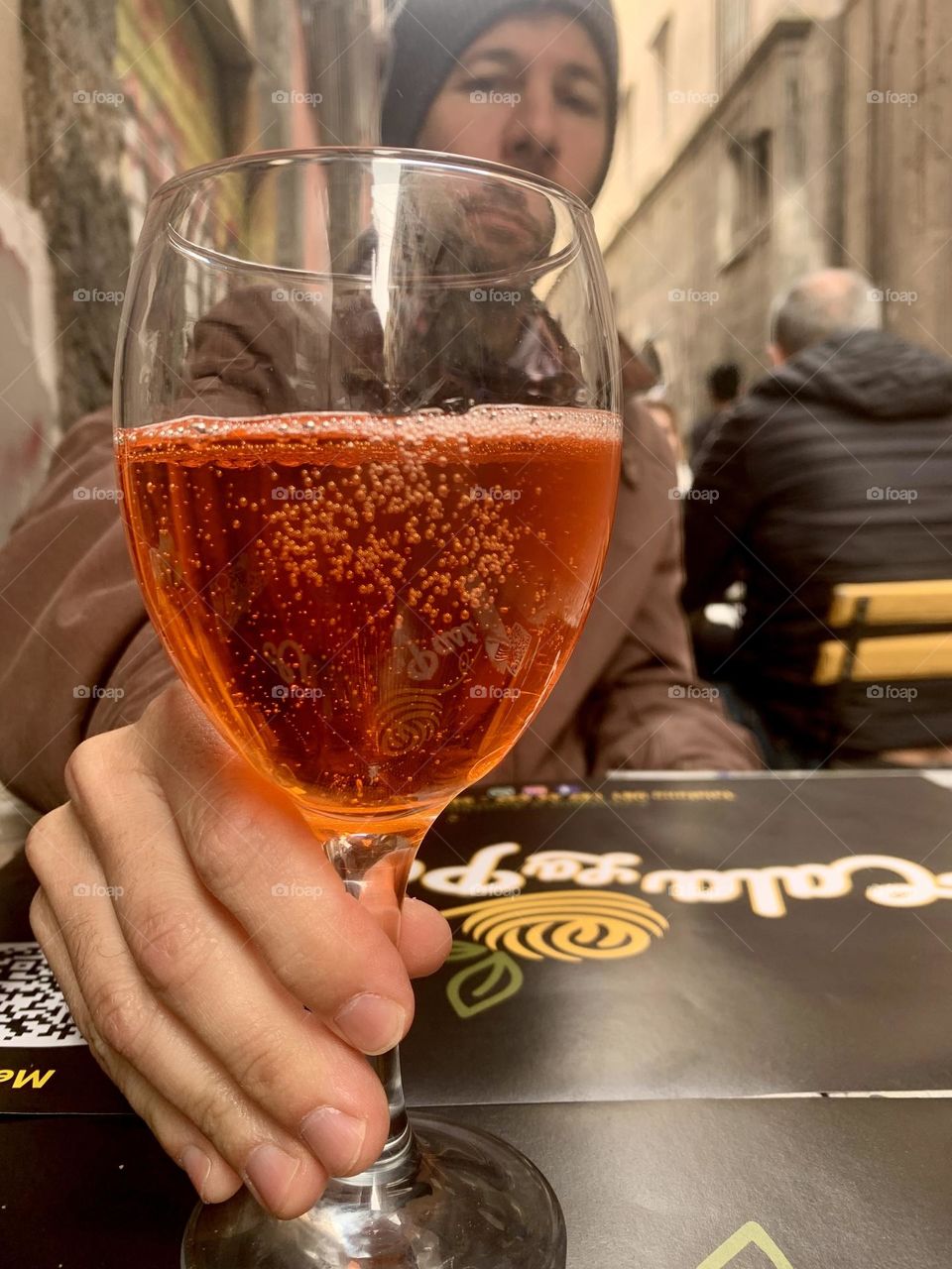 A father having a drink at street of Napoli