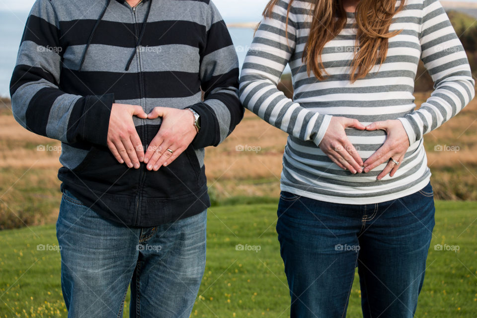 Both with a belly. My brother and his wife 