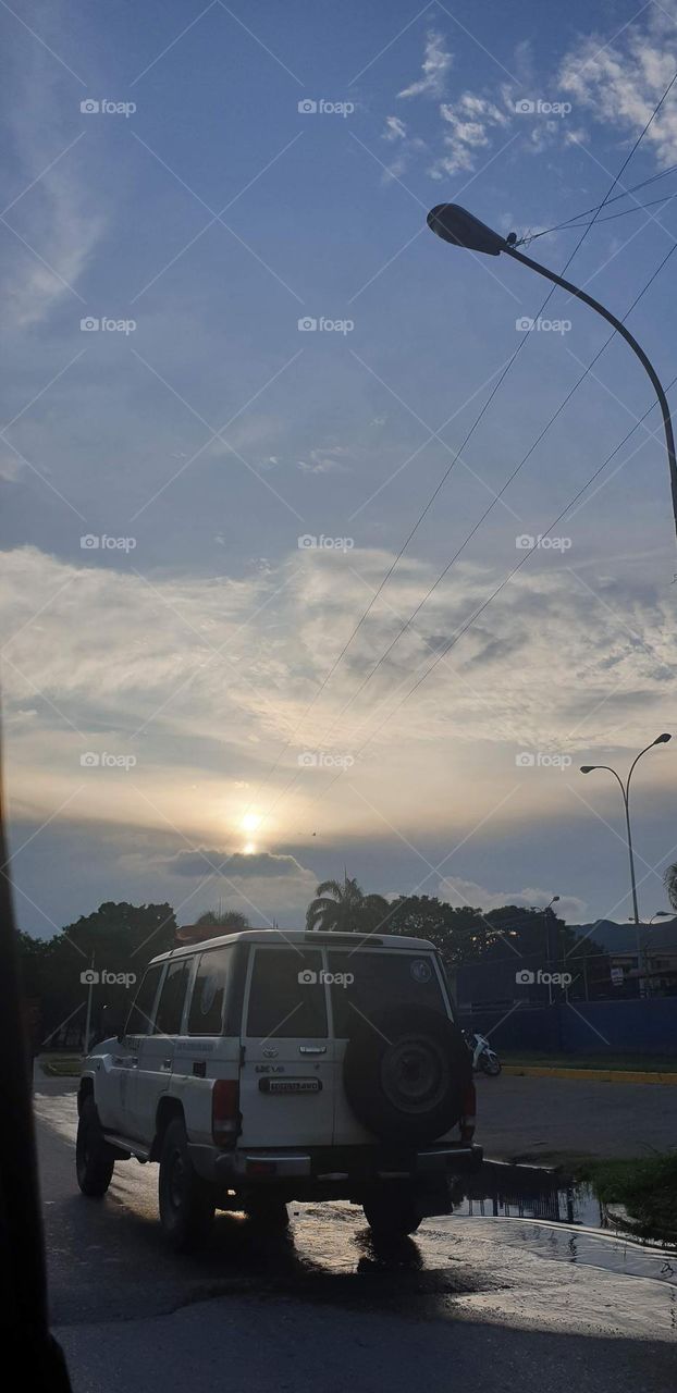 cloud in the middle of the city that resembles a volcano of light