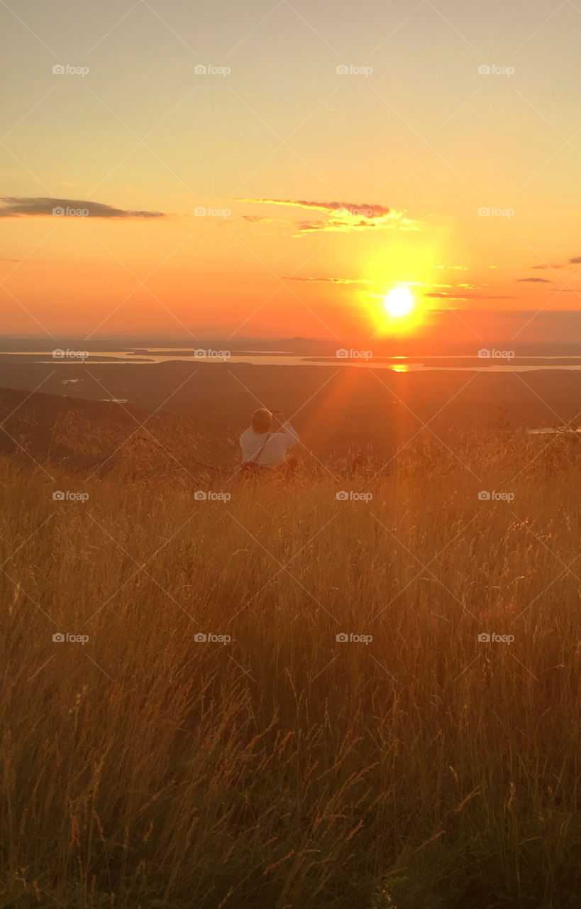 Magnificent and colorful sunset from the top of Mount Cadillac, Mount Desert Isle, Maine! This is where you catch the first sunrise in the United States! 