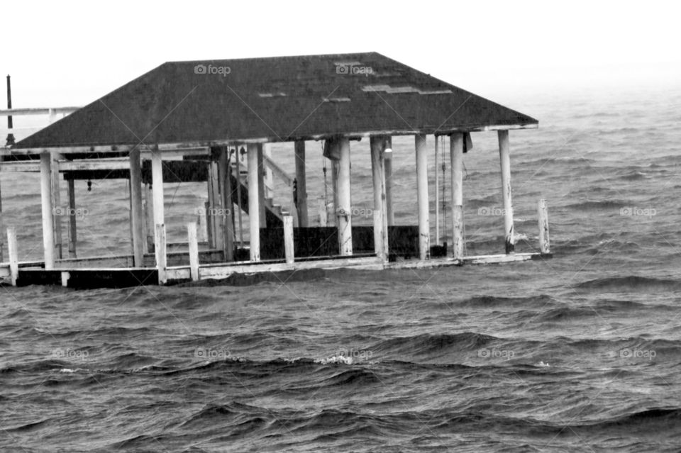 Boathouse being damaged by hurricane winds