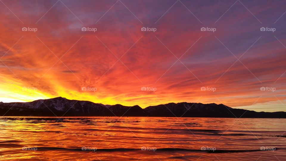 sunset over lake tahoe. had to pull over to take this when I saw it