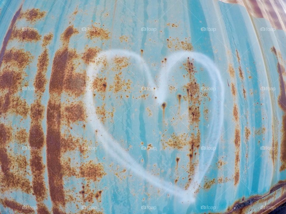 Heart shape on rusty blue background