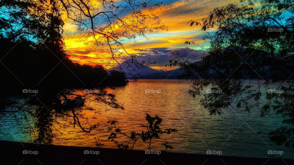 baeuty sky during sunset in the stait with two mountain on the background