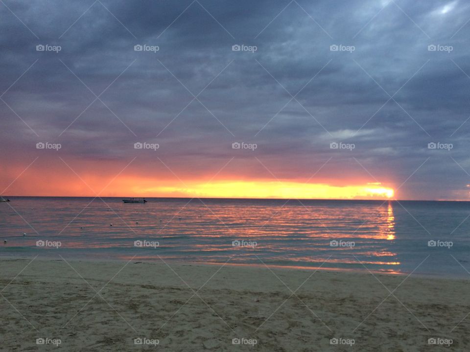 Dramatic sky reflecting on sea
