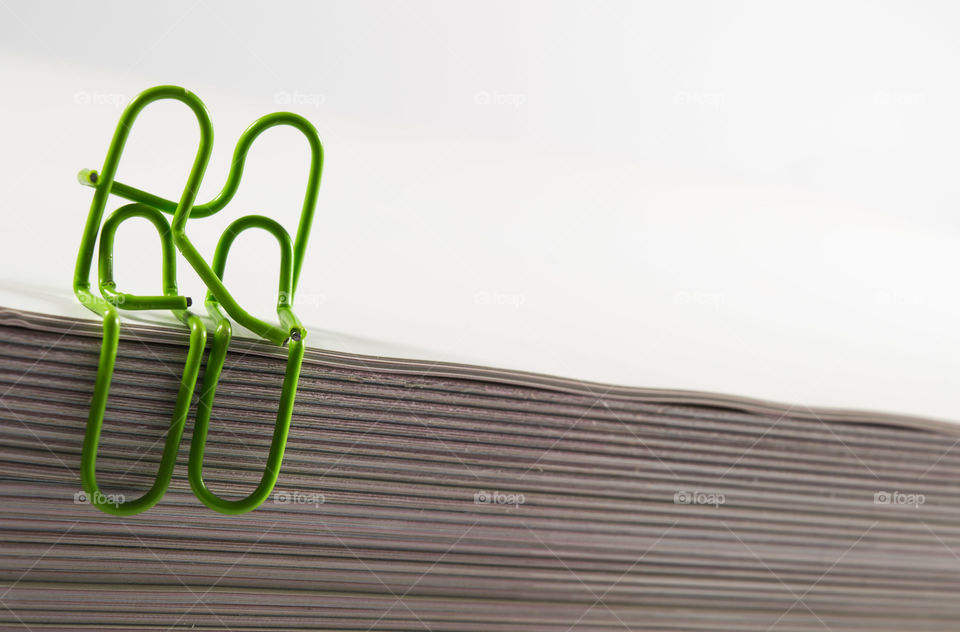 Close-up of green paper clips