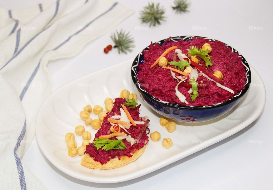 Healthy breakfast,  side view of beetroot and humus spread. Vegan and vegetarian food