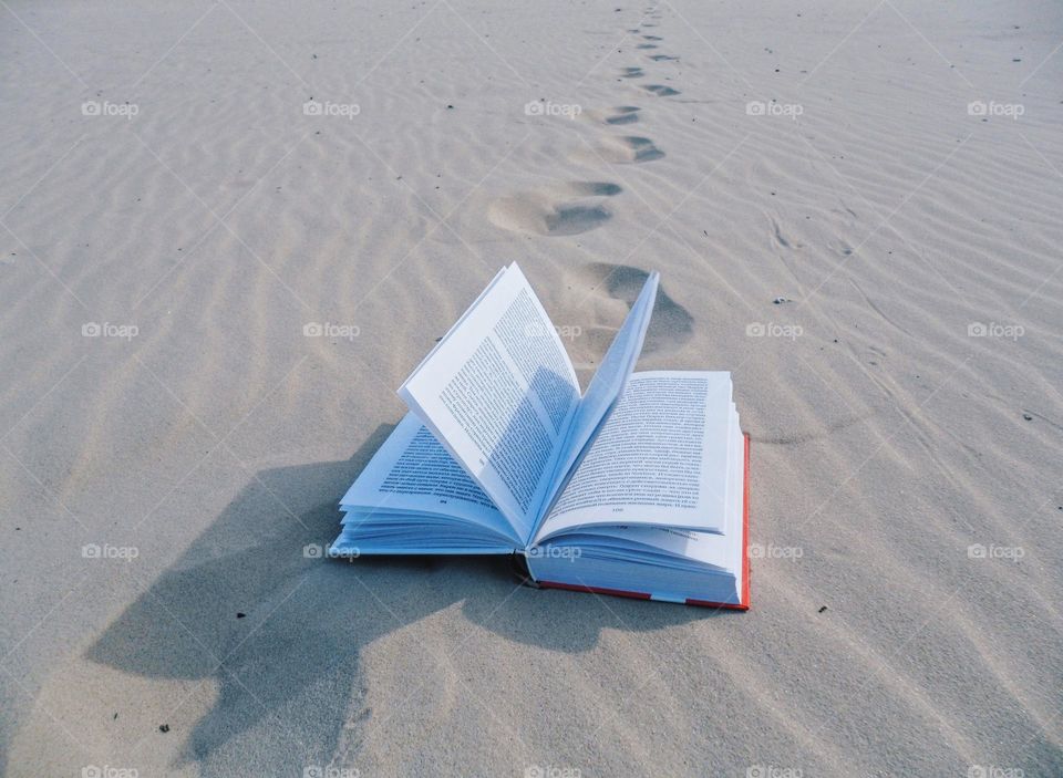 open book on the sand