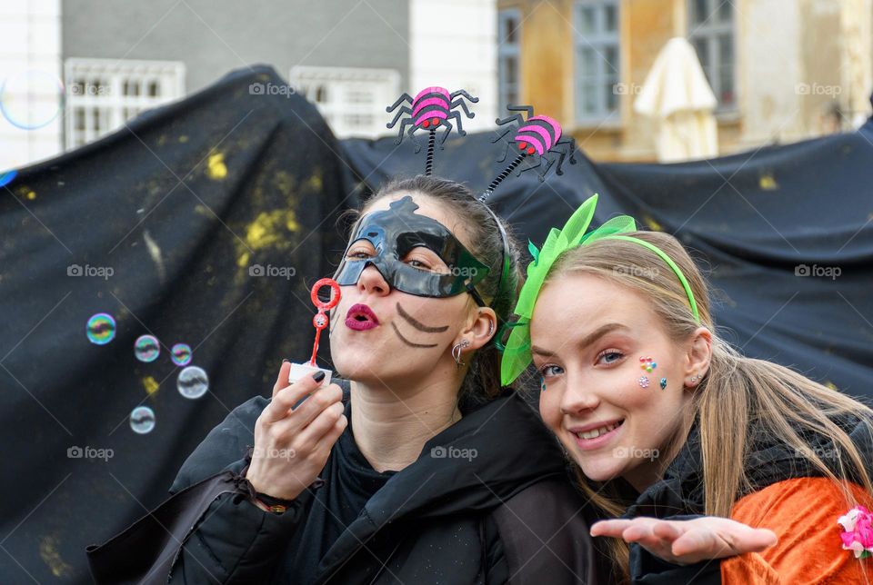 Portrait of happy girls wearing carnival costumes