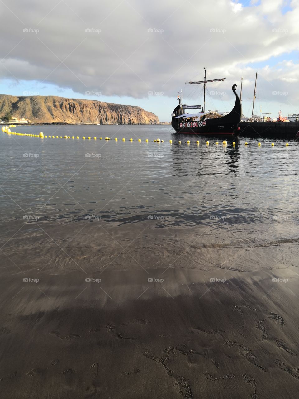 Old boat, cliffs and sea