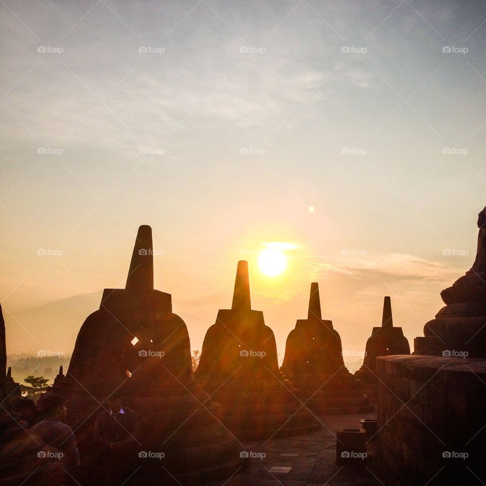 Sunrise in Borobudur. Viewing sunrise at the temple of Borobudur. This temple is a world heritage site located in Central Java of Indonesia.