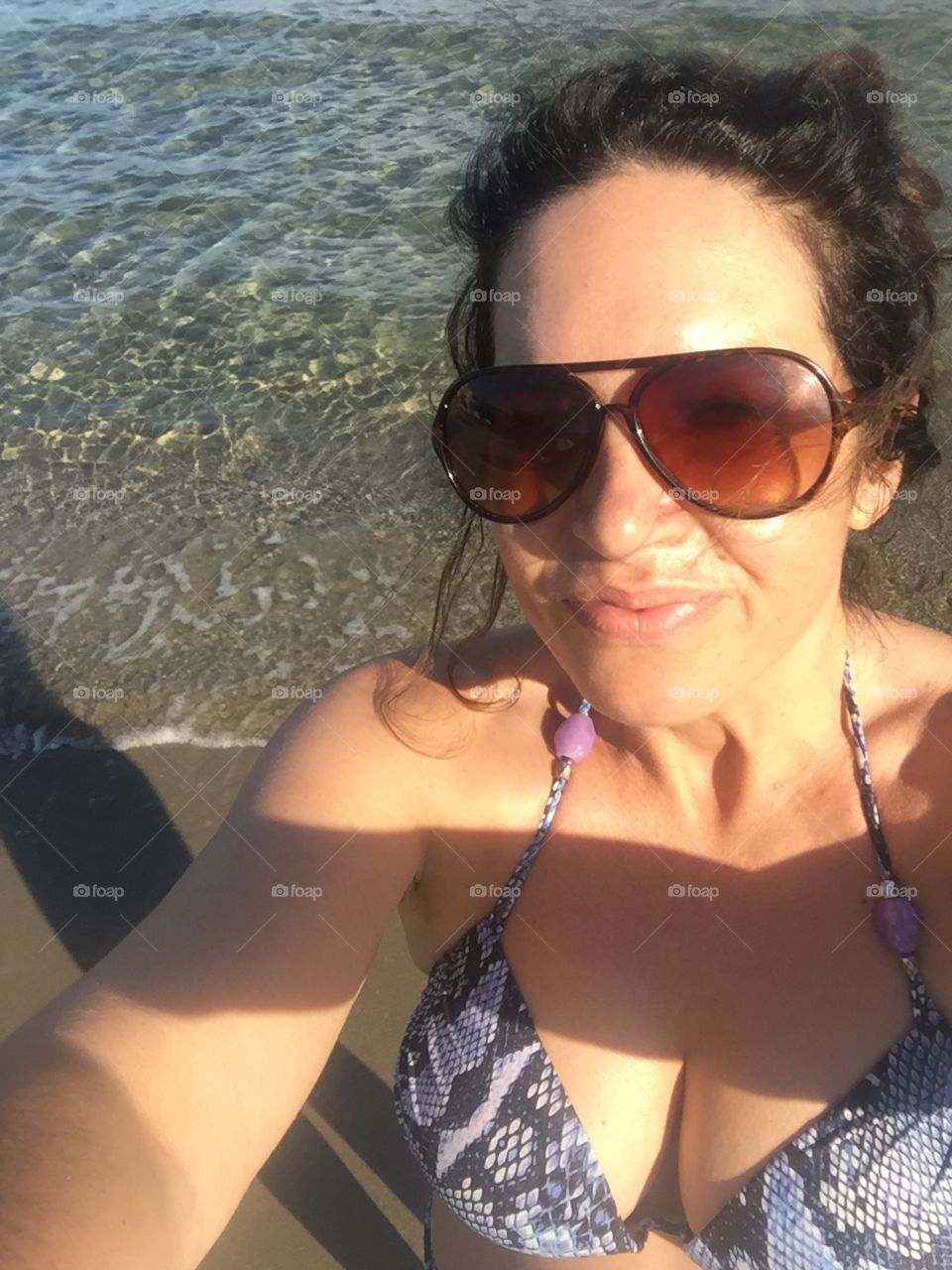 Woman beach selfie bikini