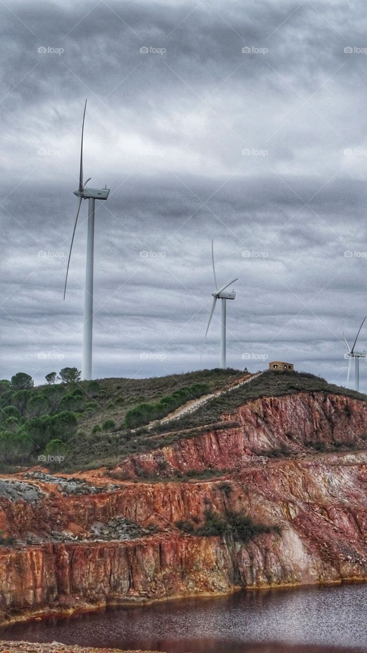 windmills under the cloudy sky