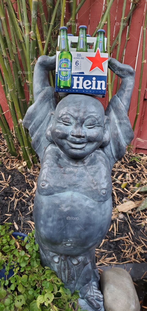 Buddha holding beer