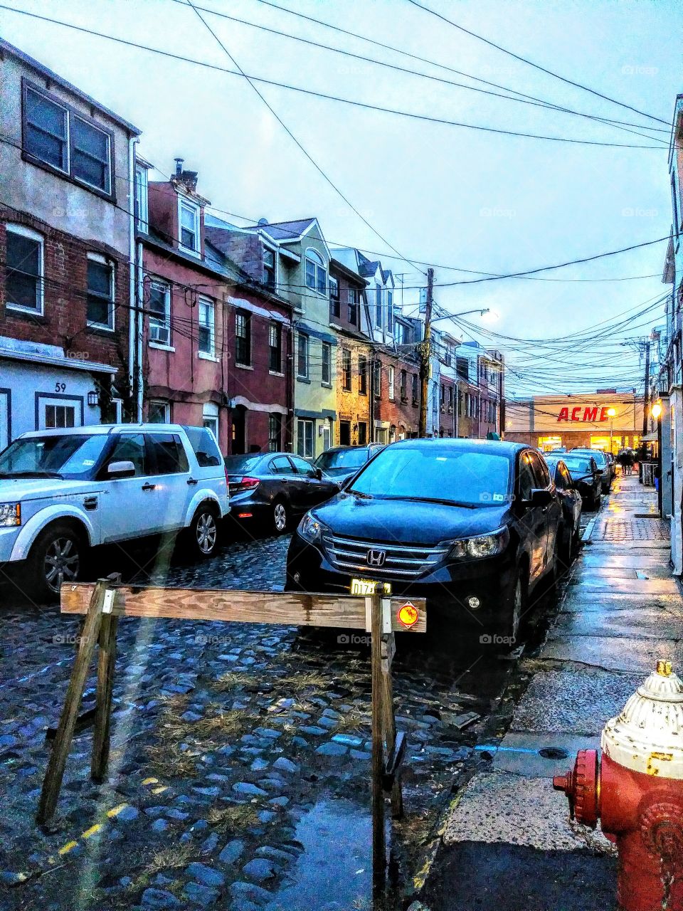 19th century cobblestone street at beginning of rainstorm Hoboken New Jersey