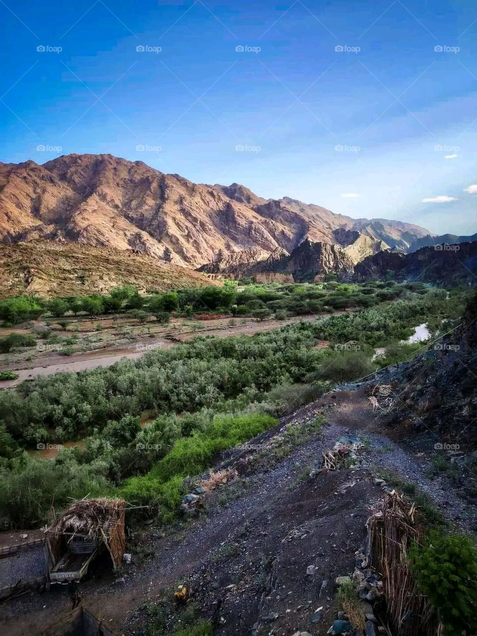 Glory be to God, the magnificent and picturesque view and the natural green trees are a view that is nothing more wonderful than it