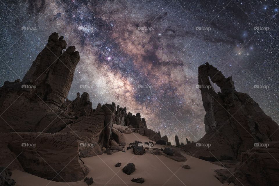 Milky Way over the amazing needles rock formations located at Tahaggart.
Algerian Sahara.