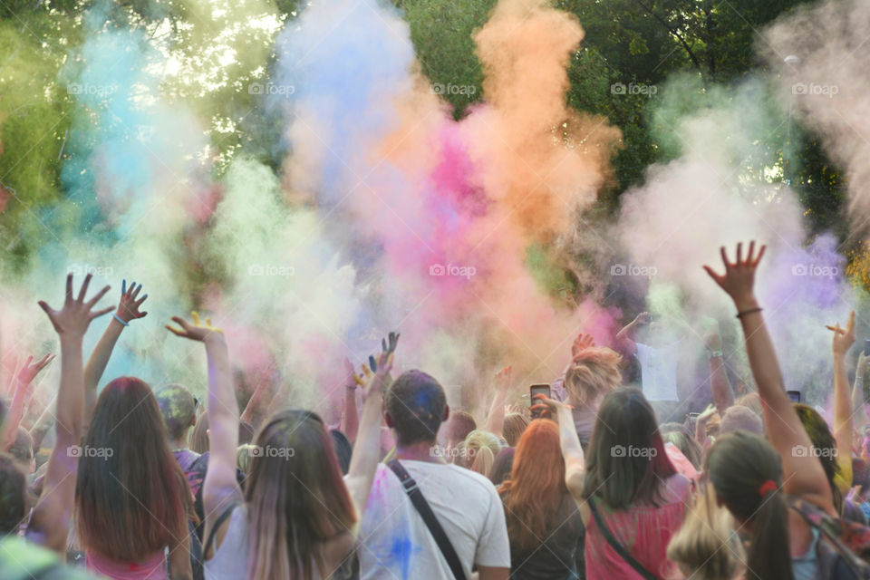 Holi festival of color. Holi colorful festival of colored paints of powders and dust. People covered with colored powder rejoice celebrate and dance