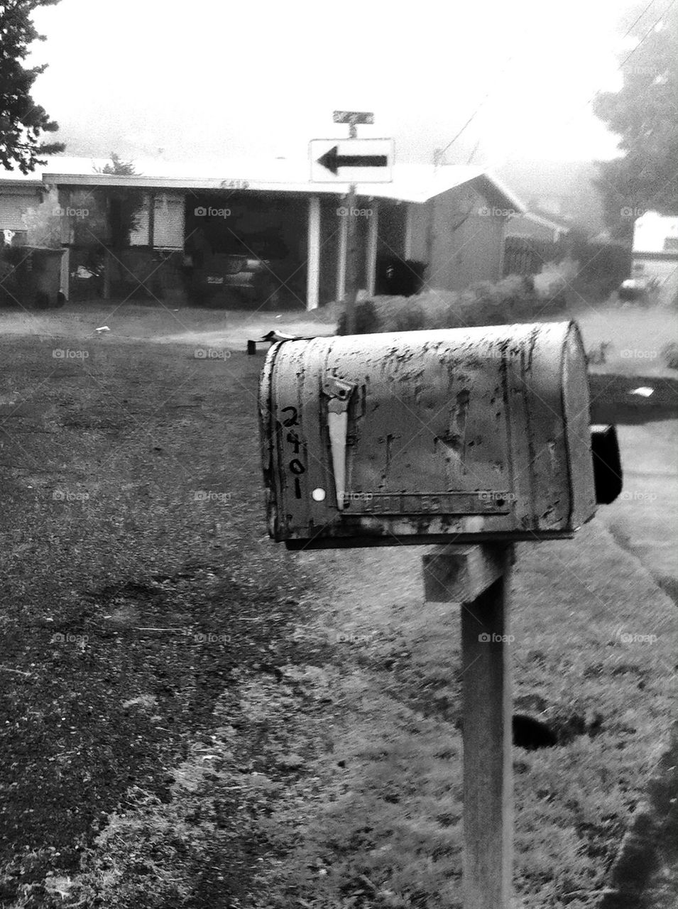 Black and white photo of mailbox