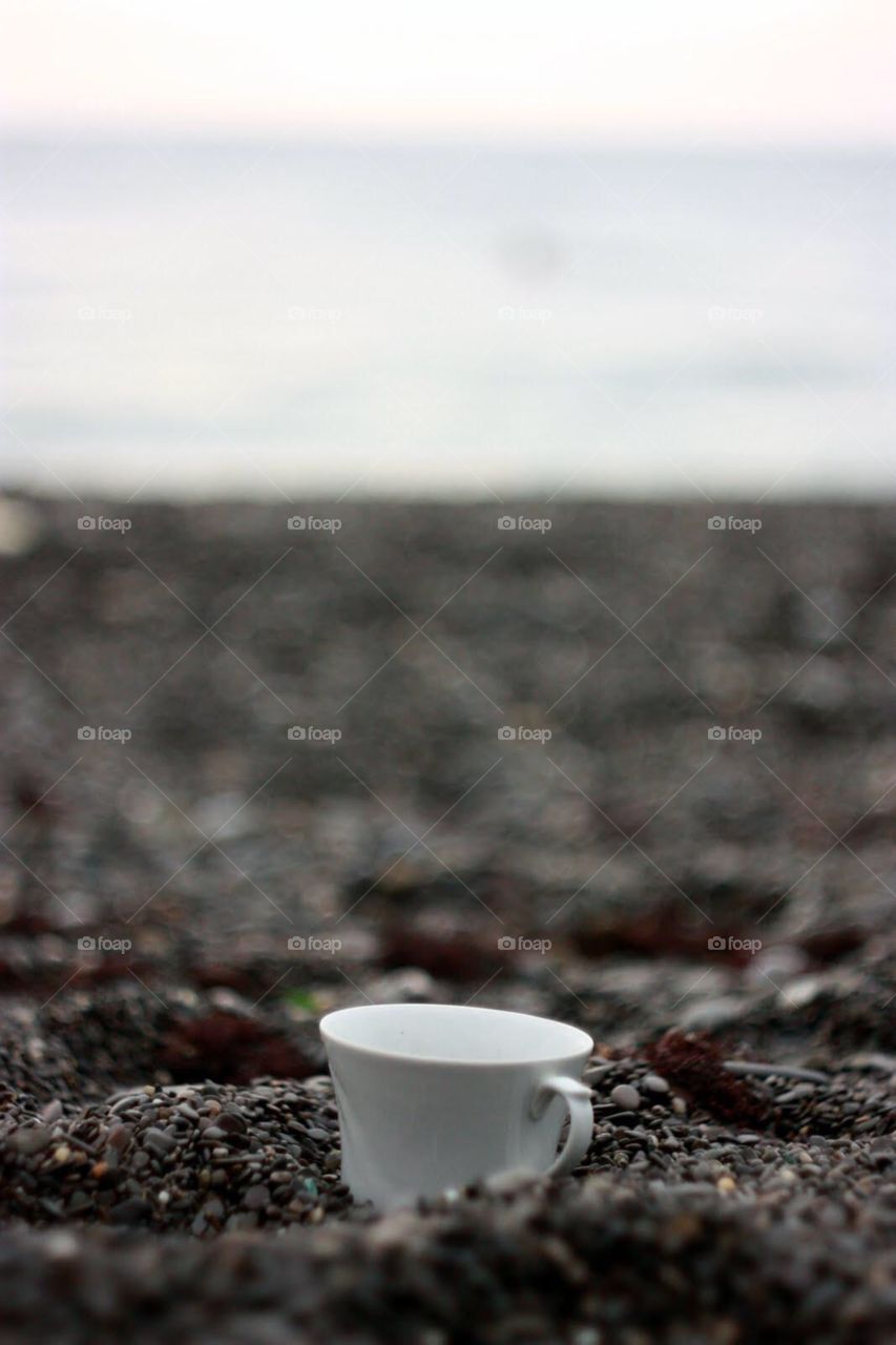 Cup of coffee at the seaside 