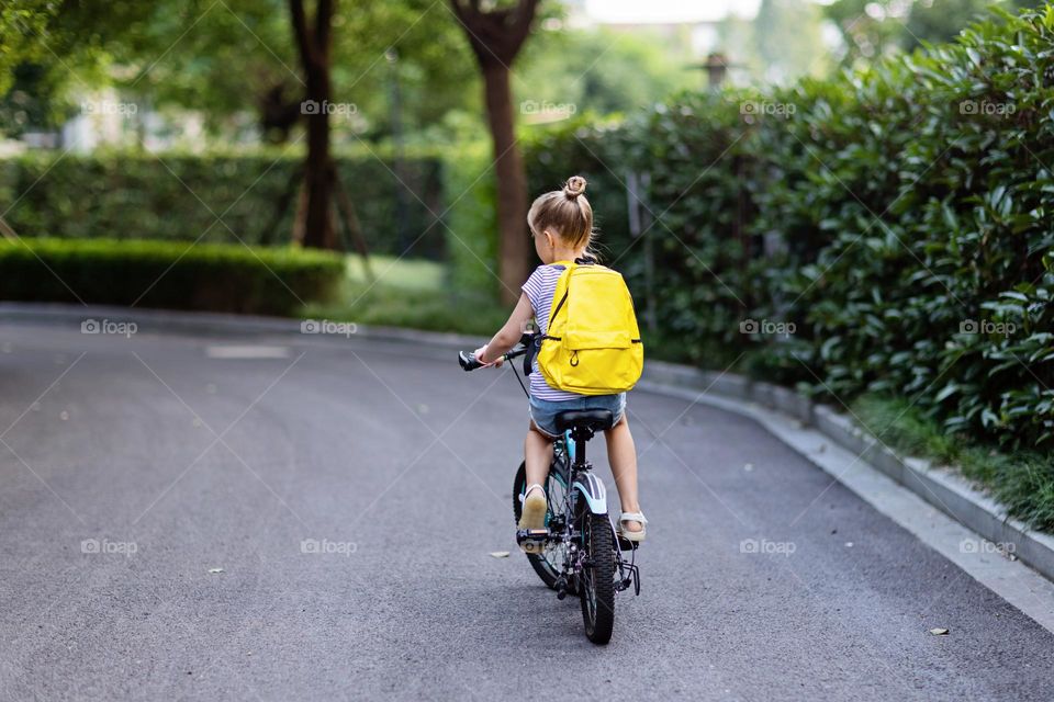 Kid riding on bicycle 