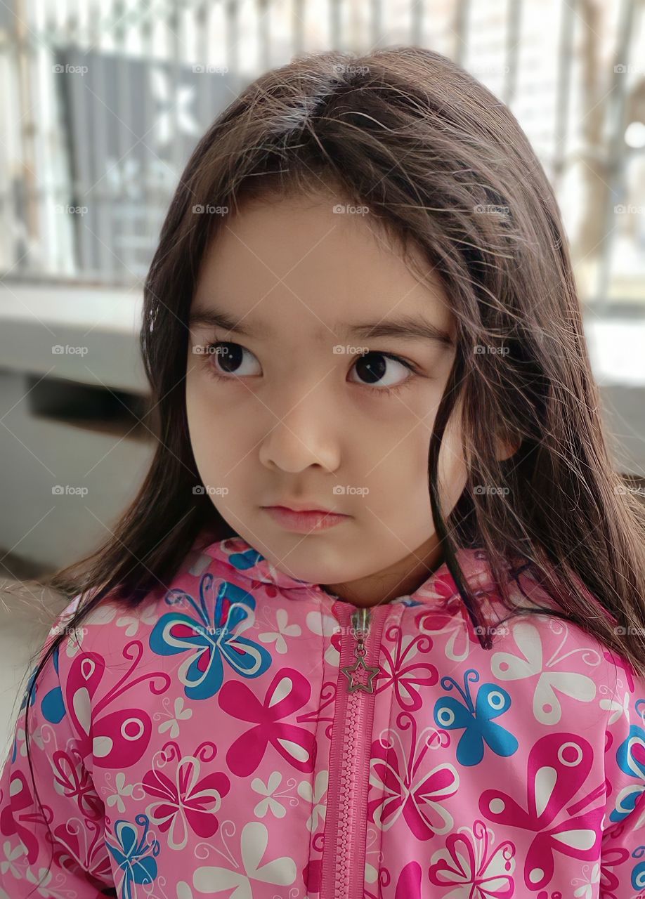 Beautiful little girl in spring portrait