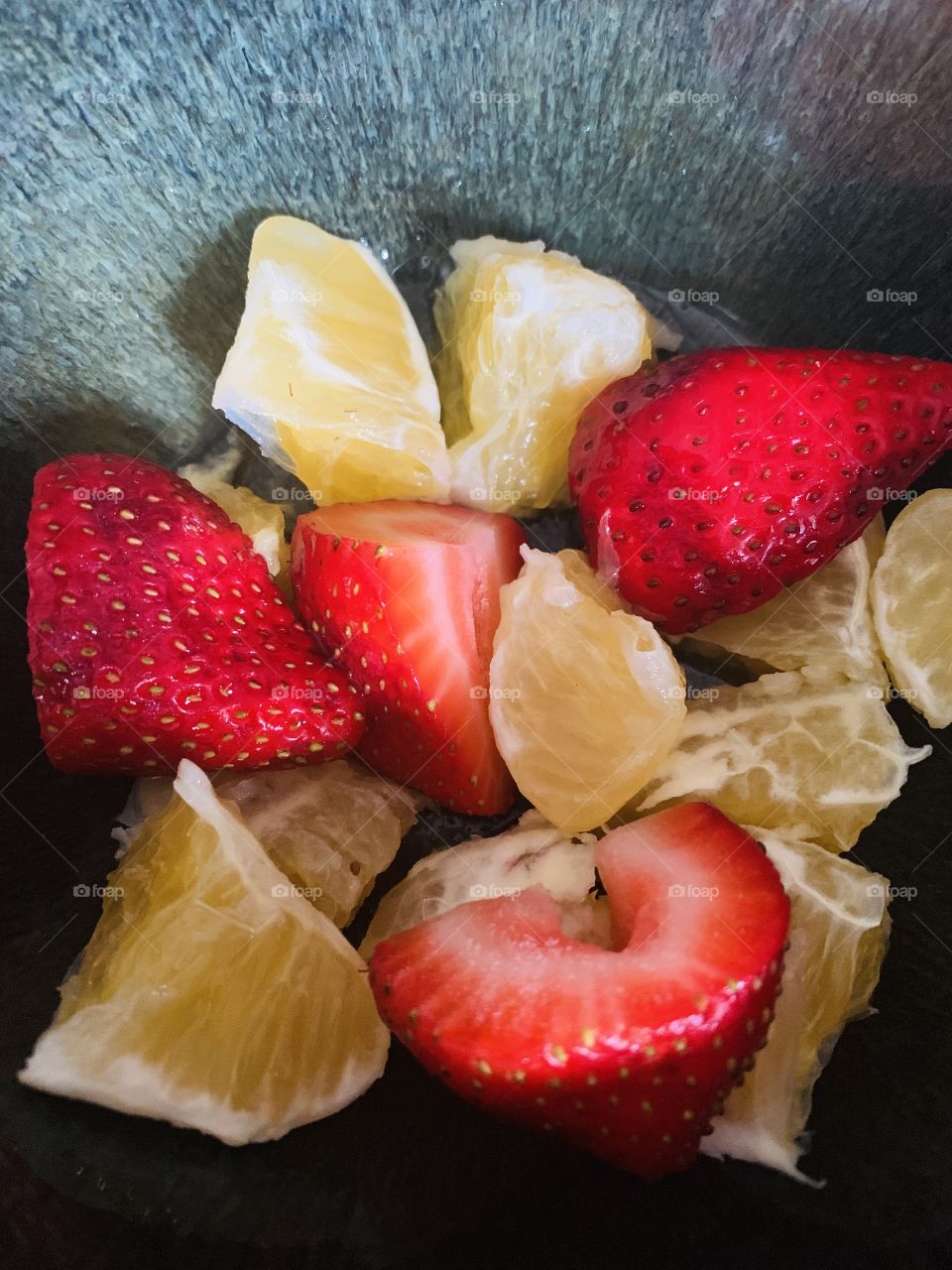 Bowl of strawberries and oranges