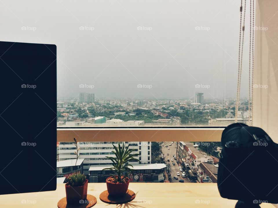 Workspace. A view from work desk with the coming storm.