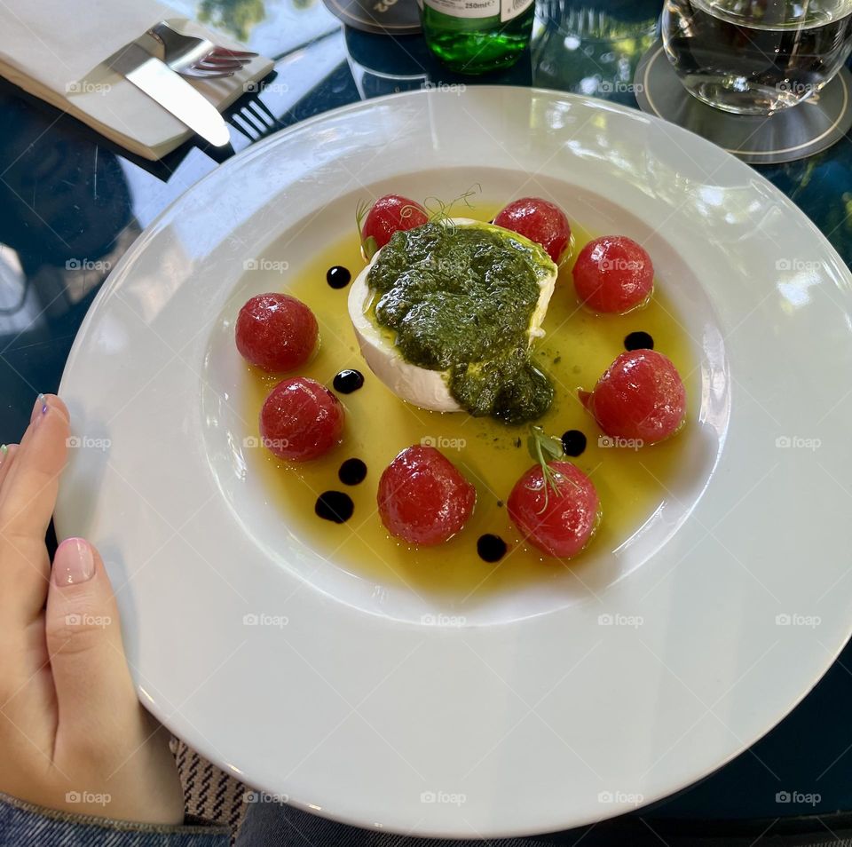 Gourmet caprese delight. Delicious meal in white plate