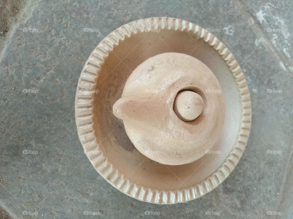 a handicraft items,desi floormil, round in shape very beautiful generally found in villages brown in colour looks very beautiful