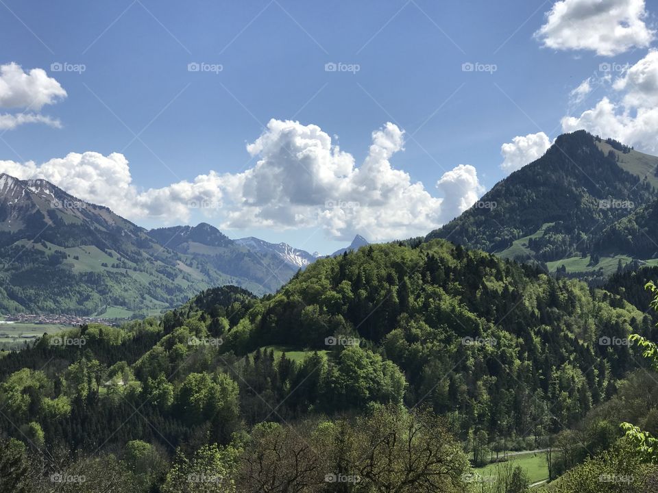 Landscape of Gruyere and surrounding mountains in the countryside of Switzerland.