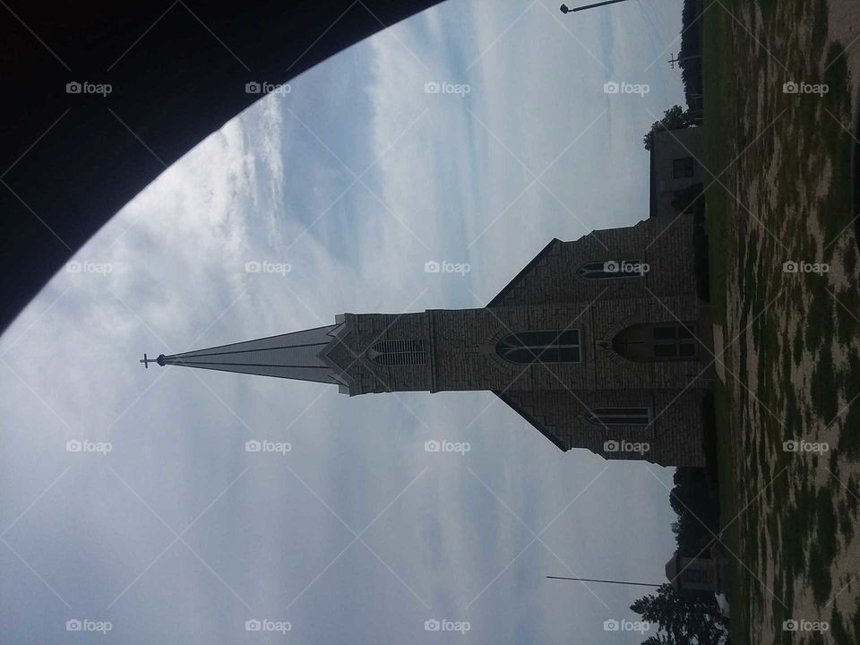 not on  side,steeple,clouds,car,bell ,tower