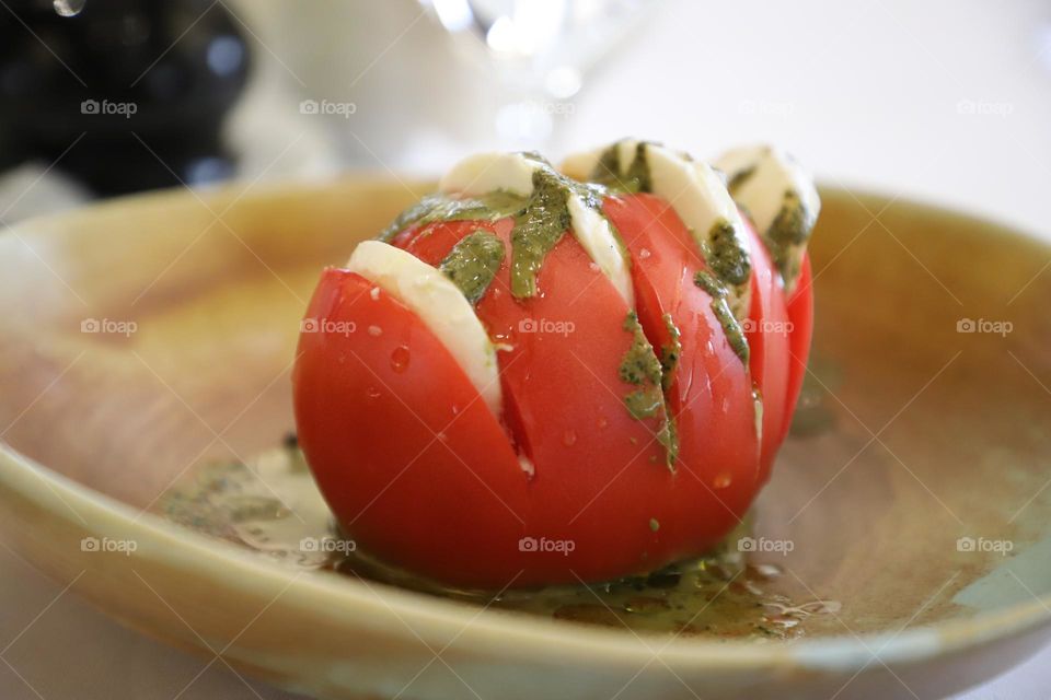 Fresh tomato filled with boconchini 