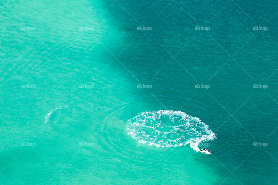 Aerial view on turquoise sea and jetski