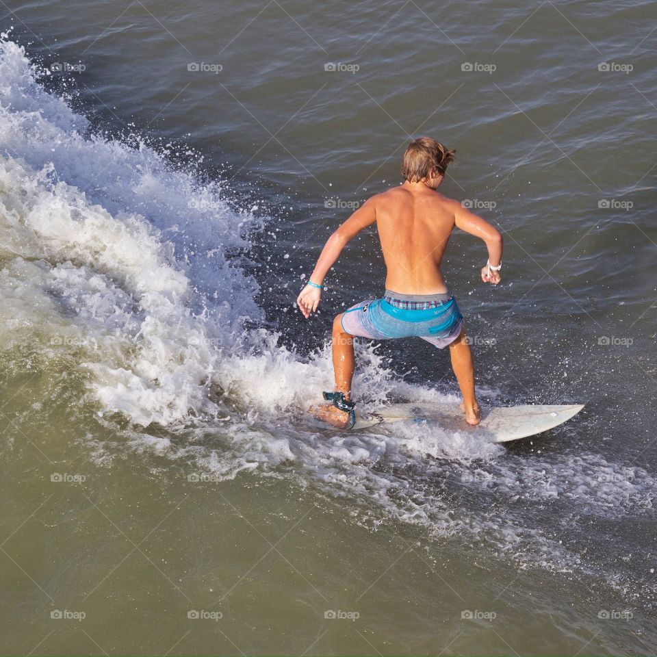 Surfing. Overhead shot of a person surfing.