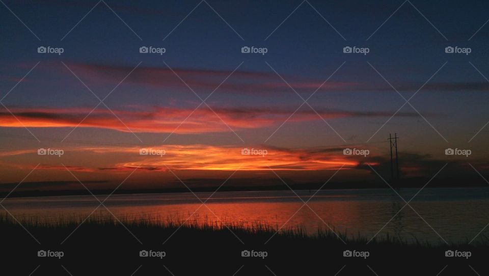 Scenic view of lake at sunrise