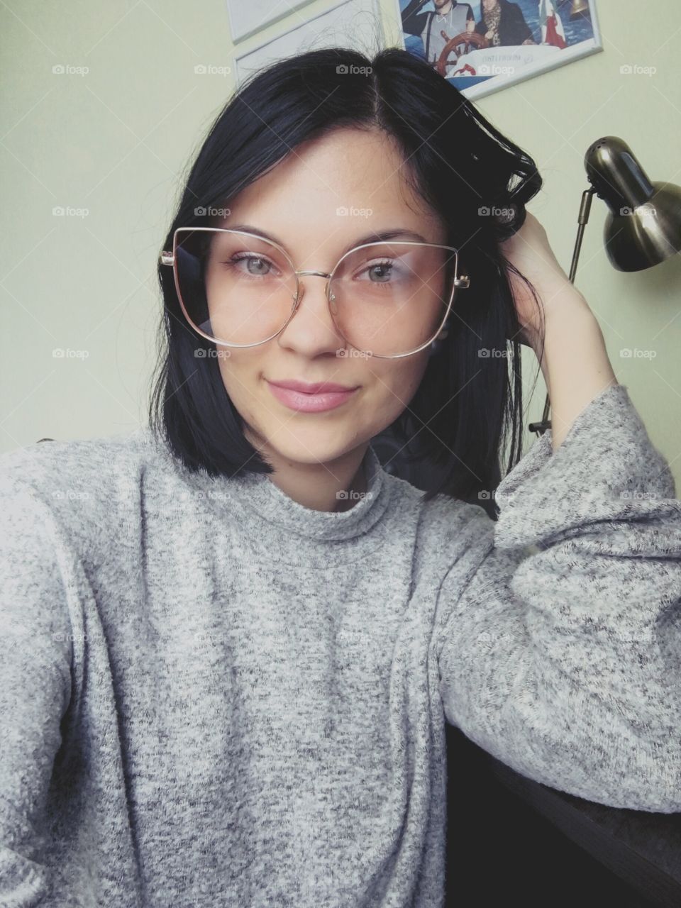 Selfie of beautiful woman in big glasses 