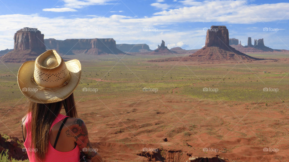 Woman is Looking the amazing landscape in the monument valley tribal park,Utah