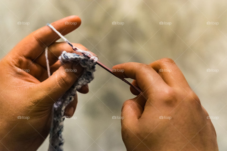 Close-up of human hand crocheting