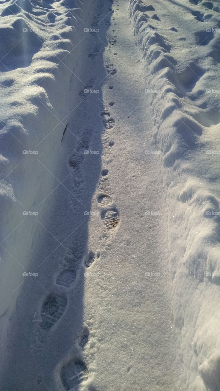 follow me. footprints in the snow