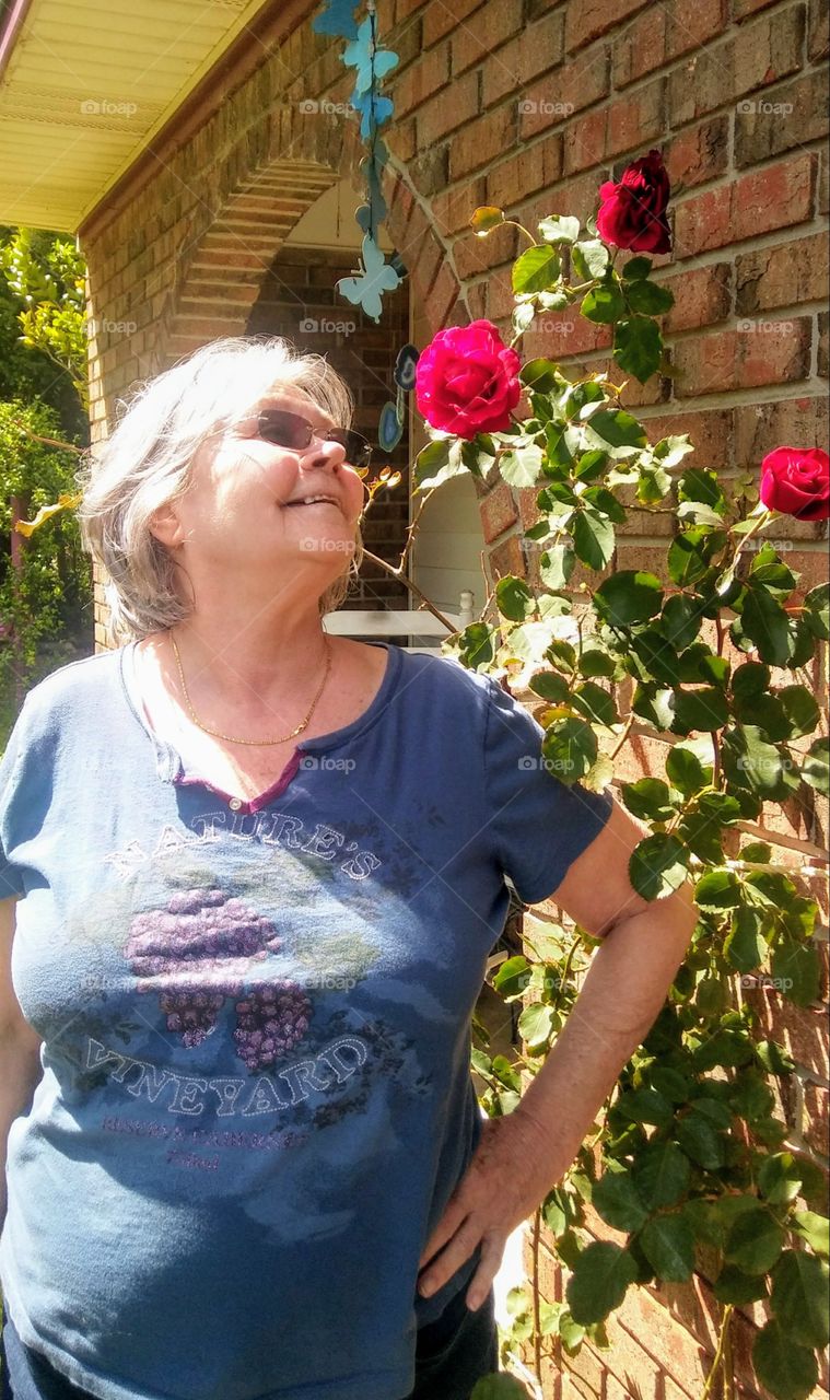 mom gazing at roses