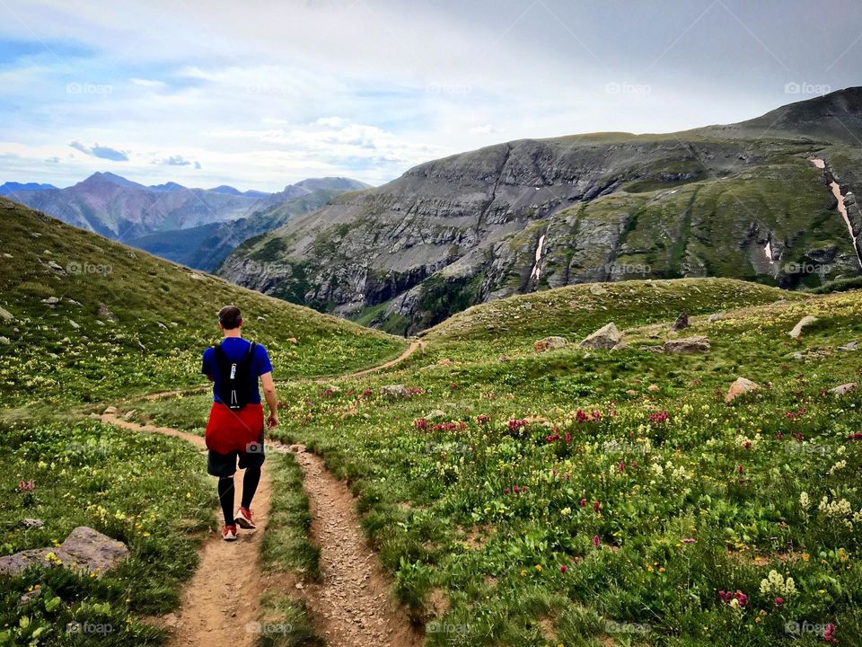 Runner on a dirt trail in the mountains of Colorado