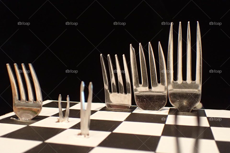 Fork Chess game board frontal view King Queen Bishop Tower Pawns