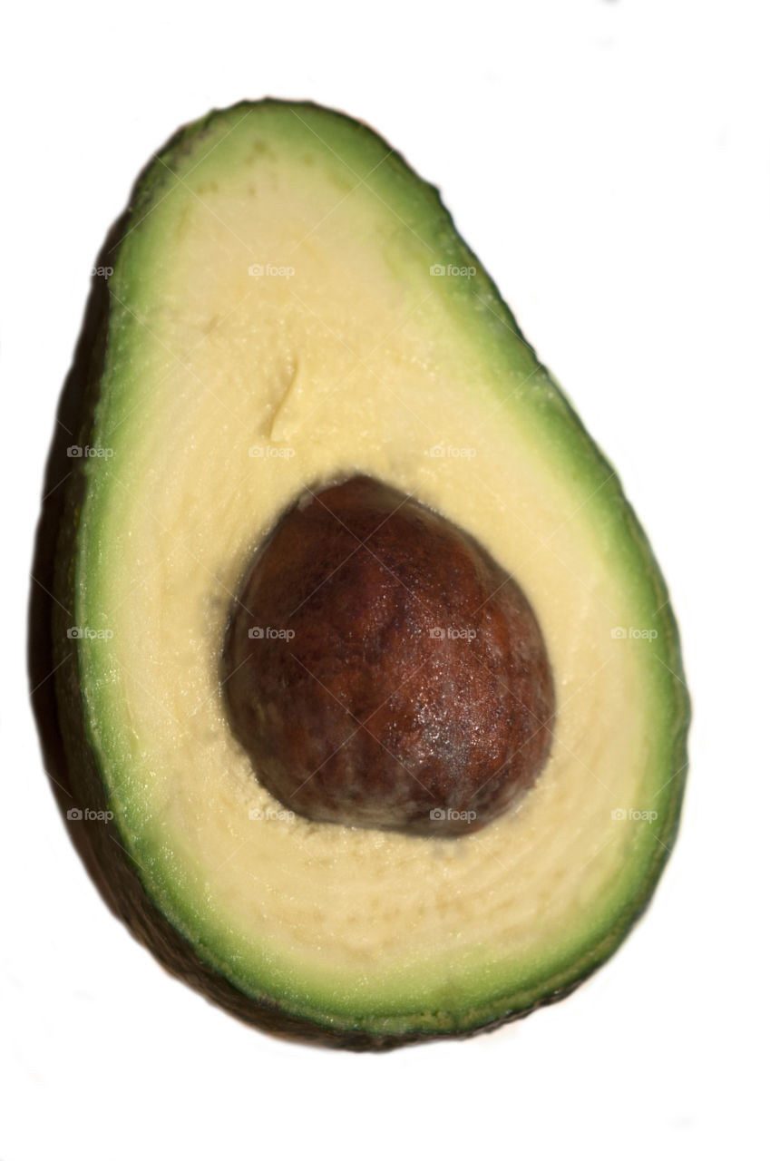 Slice of avocado on white background
