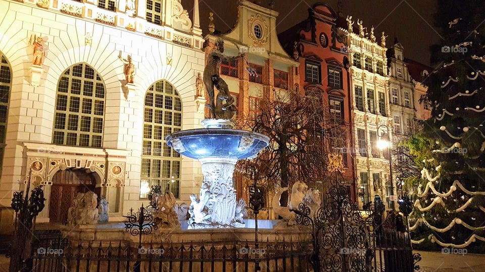 Illuminated water fountain in picturesque town centre