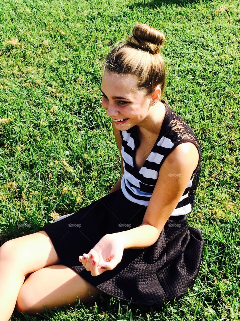 Laughing girl in grass 